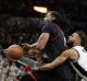 Houston Rockets centre Nene Hilario is fouled by San Antonio Spurs guard Patty Mills during game one of the western ...