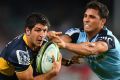 Big improver: Brumbies scrumhalf Tomas Cubelli is tackled by Nick Phipps of the Waratahs.