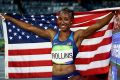 Rollins celebrates after winning the gold medal in the 100 hurdles in Rio.