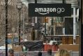 Pedestrians walk past the new Amazon.com Inc. Go grocery store in Seattle, Washington, U.S., on Wednesday, March 8, ...