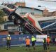 The driver of this crane broke his leg when it toppled at a building site in Taree. 