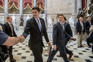 House Speaker Paul Ryan of Wis. greets guests as he walks to the House Chamber on Capitol Hill in Washington, Thursday, May 4, 2017.