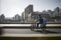 A ZTO Express courier on his delivery route in Shanghai.