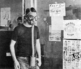 photo, Fifth Estate staffer Peter Werbe wears protective mask after offices gassed by national guard, July 1967