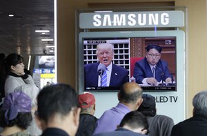 A TV screen shows images of U.S. President Donald Trump, left, and North Korean leader Kim Jong Un during a news program at the Seoul Railway Station in Seoul, South Korea, Tuesday, May 2, 2017.