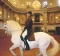 Horses under the gleaming chandeliers at the Spanish Riding School of Vienna display grace and strength.