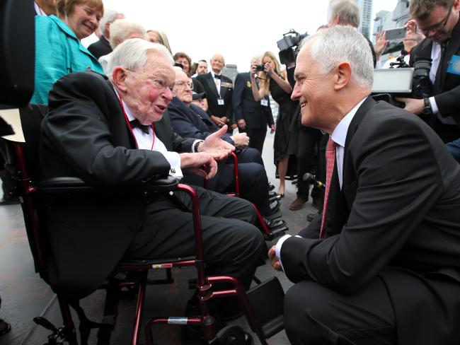 Prime Minister Malcolm Turnbull speaks with veteran Gordon Johnson, who survived the Battle of the Coral Sea at the 75th anniversary dinner on the USS Intrepid in New York City. Picture: Nathan Edwards