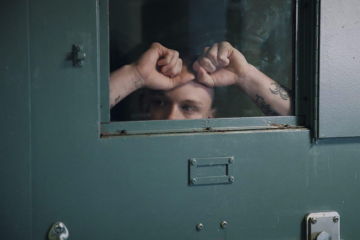 "Last Days of Solitary" follows what happens to recently released prisoners when they go from solitary to the streets. With extraordinary access to the Maine State Prison, the film examines the long-term effects of solitary confinement and efforts to reduce its use. This image shows one Maine State Prison inmate looking out of his solitary confinement cell window. (Photo by FRONTLINE)