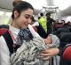 Turkish Airlines cabin crew pose with newborn Kadiju. 