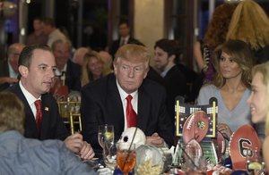 President Donald Trump, center, first lady Melania Trump, second from right, and White House Chief of Staff Reince Priebus, left, attend a Super Bowl party at Trump International Golf Club in West Palm Beach, Fla., Sunday, Feb. 5, 2017.