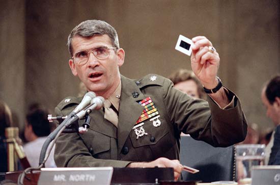 Oliver North testifying at the Iran-Contra hearings in Washington, D.C., 1987.