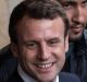 Macron meets with supporters during an election campaign event in Rodez on Friday.