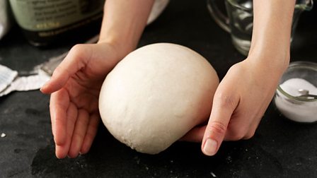 Shaping a loaf of bread