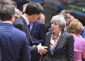 File - British Prime Minister Theresa May, center right, speaks with Dutch Prime Minister Mark Rutte, center left, during a round table meeting at an EU summit in Brussels on Thursday, March 9, 2017.