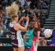 Mwai Kumwenda of the Vixens clashes with the Firebirds defence 