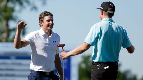 Australian Cameron Smith (left) and Jonas Blixt of Sweden react after putting in to win in a sudden-death play-off.