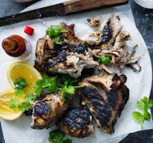 Simmering before charring ensures the success of your jerk chicken.