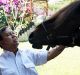 Prabowo Subianto feeding him horse