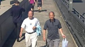 A CCTV image of two men police would like to speak with over an indecent assault on the Sydney Harbour Bridge.