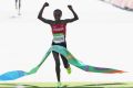 Making history: Jemima Jelagat Sumgong of Kenya crosses the finish line at the Rio 2016 women's marathon.