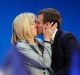 New French president Emmanuel Macron kisses his wife Brigitte.