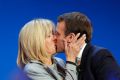 New French president Emmanuel Macron kisses his wife Brigitte.