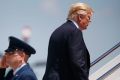 President Donald Trump boards Air Force One.