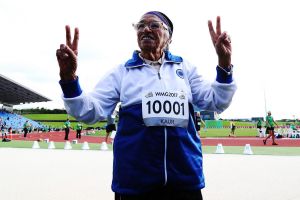  Man Kaur of India celebrates after competing in the 85-year-olds age group 100m sprint at the World Masters Games.