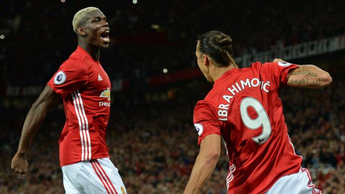 Manchester United's Swedish striker Zlatan Ibrahimovic (R) celebrates with Manchester United's French midfielder Paul Pogba after scoring their second goal from the penalty spot during the English Premier League football match between Manchester United and Southampton at Old Trafford in Manchester, north west England, on August 19, 2016. / AFP PHOTO / Oli SCARFF / RESTRICTED TO EDITORIAL USE. No use with unauthorized audio, video, data, fixture lists, club/league logos or 'live' services. Online in-match use limited to 75 images, no video emulation. No use in betting, games or single club/league/player publications. /