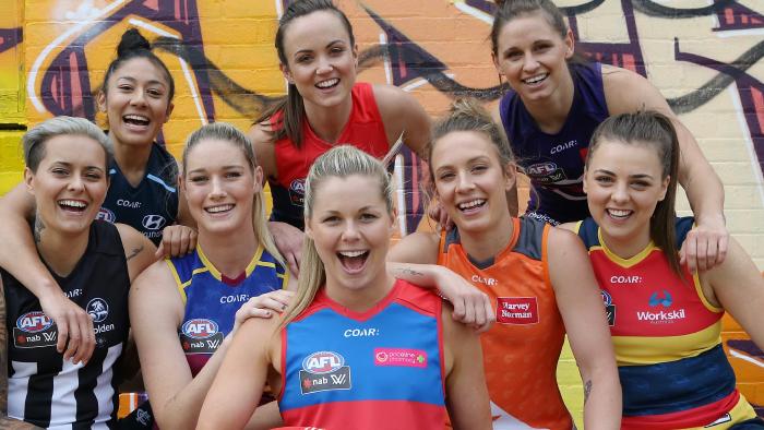 AFL Women's players parade next season's jumpers.