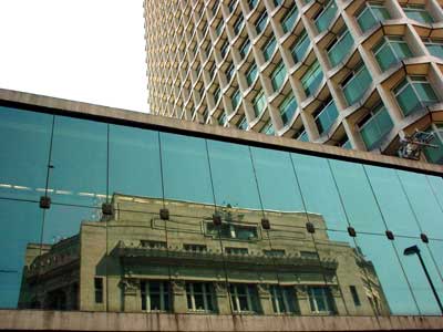 Reflections on the north side of the tower, facing New Oxford Street. The road/pedestrian underpass runs underneath