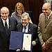  State Sen. Jack Fry, center, holds a proclamation recognizing the Oklahoma Department of...