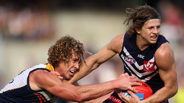 PERTH, AUSTRALIA - AUGUST 16:  Matt Priddis of the Eagles tackles Nathan Fyfe of the Dockers during the round 20 AFL match between the Fremantle Dockers and the West Coast Eagles at Domain Stadium on August 16, 2015 in Perth, Australia.  (Photo by Paul Kane/Getty Images)