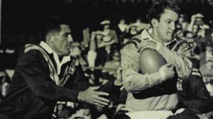 Proud tradition: Johnny Raper is tackled by the Country defence during the 1966 Sydney versus Country match.