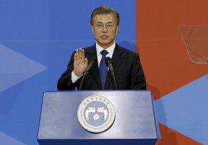 Newly elected South Korean President Moon Jae-in takes an oath during his inauguration ceremony at the National Assembly in Seoul, South Korea, Wednesday, May 10, 2017.