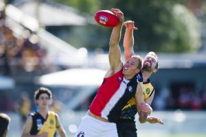 Ainslie's Ben Perry and Queanbeyan's Ryan Quade compete for the ball.