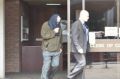 Clive William Black leaves court with his lawyer following an earlier appearance.