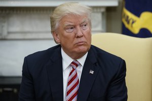 President Donald Trump pauses as he talks to reporters during a meeting with former Secretary of State Henry Kissinger in the Oval Office of the White House, Wednesday, May 10, 2017, in Washington. (AP Photo/Evan Vucci)