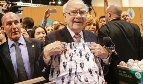 Berkshire Hathaway Chairman and CEO Warren Buffett displays Berky Shorts, made by Fruit of the Loom, one of the ...
