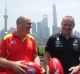 Gold Coast Suns coach Rodney Eade with Port Adelaide coach Ken Hinkley in front of the Pudong skyline in Shanghai.