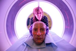 Conservator and restorer Valerie Kaufmann poses with a wax-work head of Admiral Horatio Nelson in a CT scanner before it ...