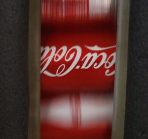 Coca-Cola Co. Classic brand soda cans move along a conveyor belt at the Ball Corp. beverage can manufacturing facility ...