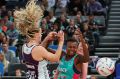 Mwai Kumwenda of the Vixens clashes with the Firebirds defence 