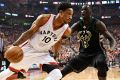 Toronto Raptors guard DeMar DeRozan  drives to the net against Milwaukee Bucks forward Thon Maker.