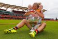 Adelaide's Erin Phillips celebrates her side's AFLW premiership win with her twins Blake and Brooklyn.