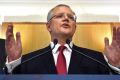 Treasurer Scott Morrison speaks at a news conference inside the budget lock-up at Parliament House.