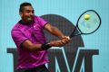 Nick Kyrgios plays a backhand in his match against Ryan Harrison of USA during day five of the Mutua Madrid Open.