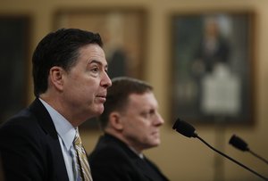 FBI Director James Comey, left, accompanied by National Security Agency Director Michael Rogers testifies on Capitol Hill in Washington, Monday, March 20, 2017, before the House Intelligence hearing on allegations of Russian interference in the 2016 U.S. presidential election