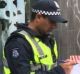 Police speaking to the public outside Melbourne Central after the reported stabbing.