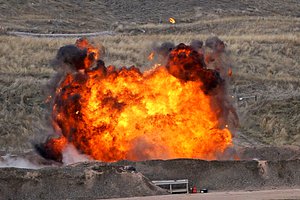 A controlled explosion takes place at a bomb range